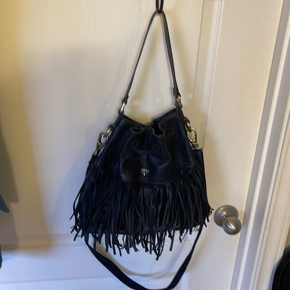 Good condition. Black bucket style purse with fringes.